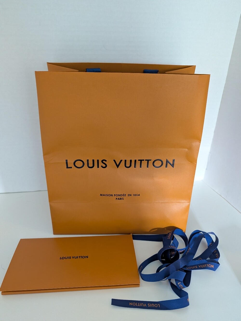 Louis Vuitton Orange Shopping Bag with Blue Ribbon Accents